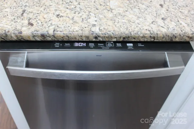 a kitchen with a refrigerator and cabinets
