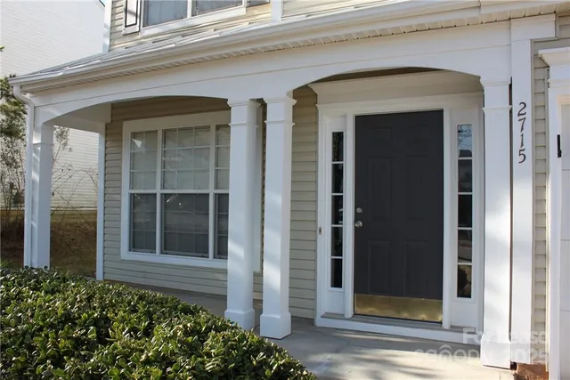 front view of a brick house with a large door