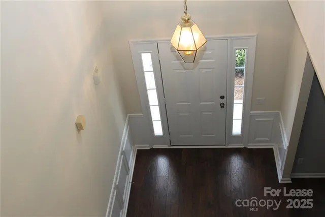 a view of a livingroom with wooden floor