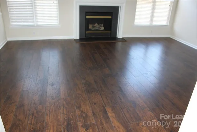 a kitchen with sink a microwave and cabinets