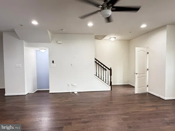 a view of an entryway with wooden floor