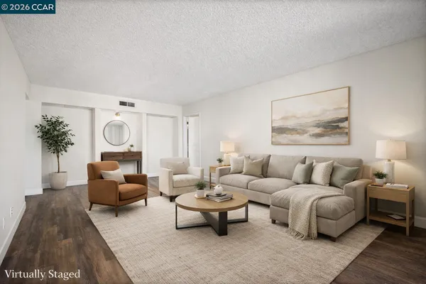 a living room with furniture and a large window