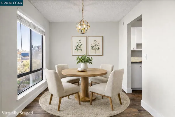 a view of a dining room with furniture window and outside view