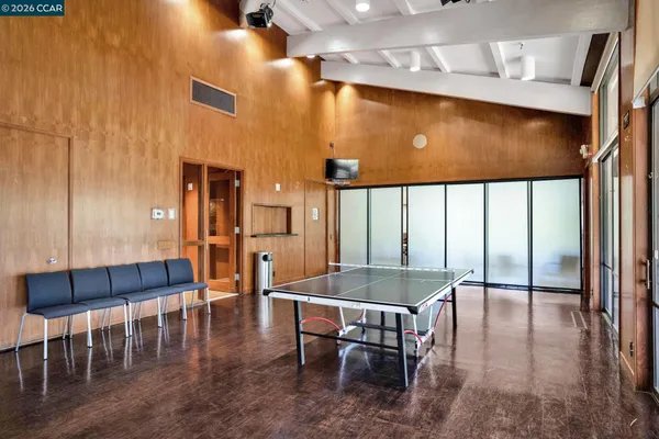 a room with gym equipment and windows