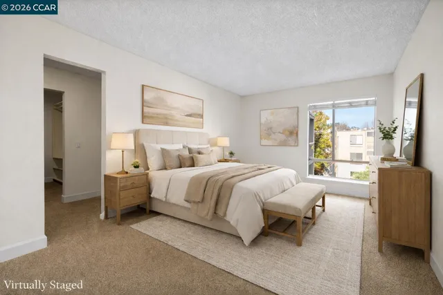 an empty room with windows and closet