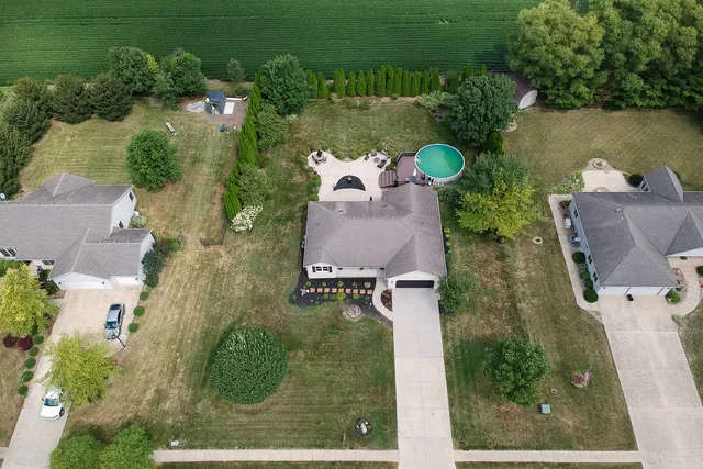 a large bedroom with a bed and a large window