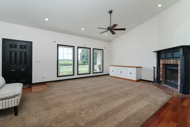a kitchen with a stove a sink and a window