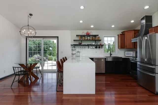 a view of a dining room with furniture window and wooden floor