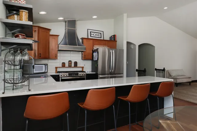 a white toilet sitting next to a shower