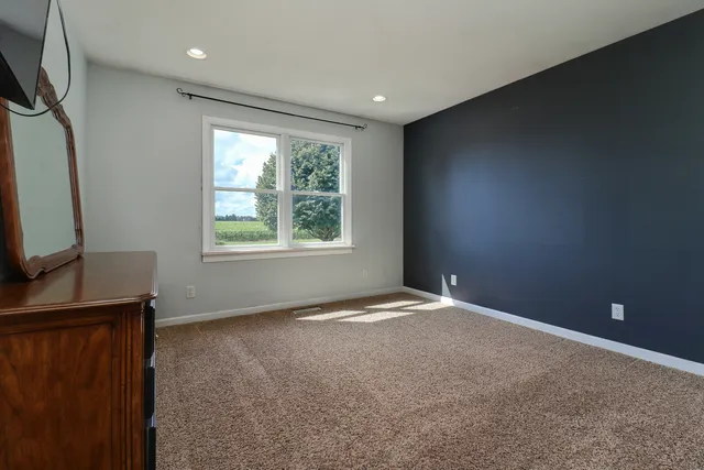 a view of room with furniture and flowers