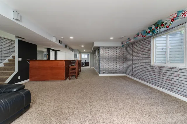 a view of a patio with couches chairs and a yard