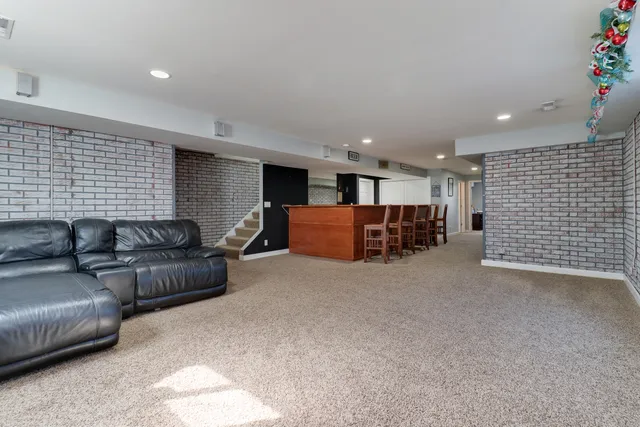 a view of a patio with swimming pool and table and chairs