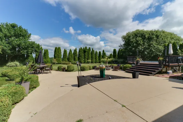 a view of a swimming pool with an outdoor space and seating area