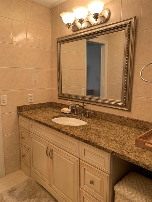 1541 South Ocean Boulevard, Unit 122 Pompano Beach, FL 33062 - Photo 13 of 30 a bathroom with a granite countertop sink and a mirror