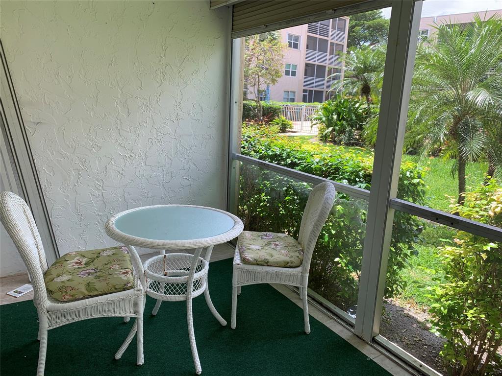 1541 South Ocean Boulevard, Unit 122 Pompano Beach, FL 33062 - Photo 20 of 30 a outdoor dining space with furniture
