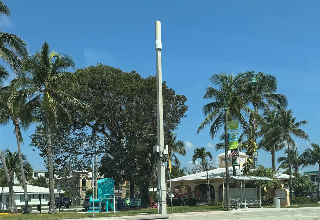 1541 South Ocean Boulevard, Unit 122 Pompano Beach, FL 33062 - Photo 27 of 30 a front view of a building with palm trees