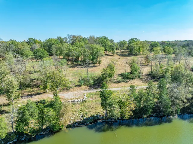 a view of a lake with a yard