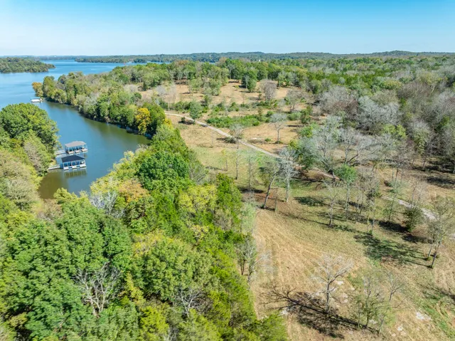a view of lake with green space