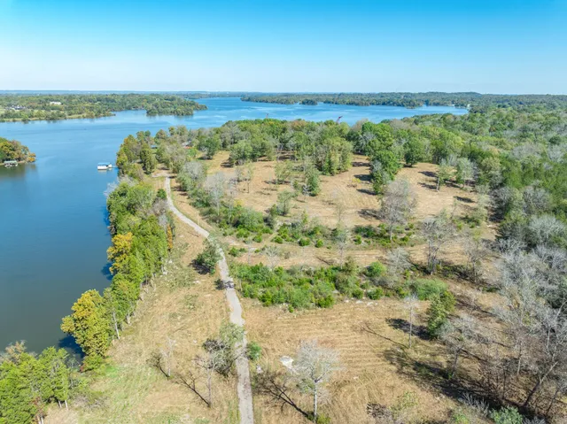 a view of a lake with houses in the back