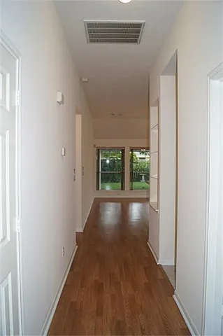 a view of gallery with wooden floor