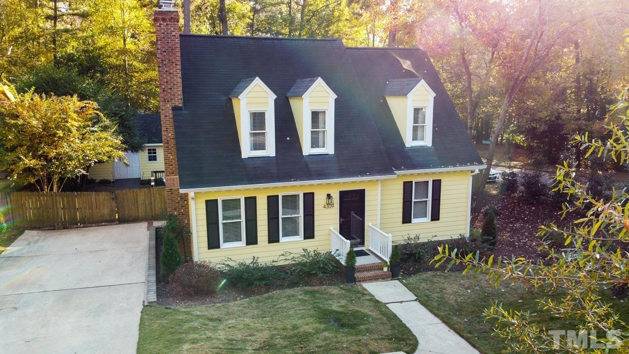 4309 Pleasant Grove Church Road Raleigh, NC 27613 - Photo 2 of 29 front view of house with a yard