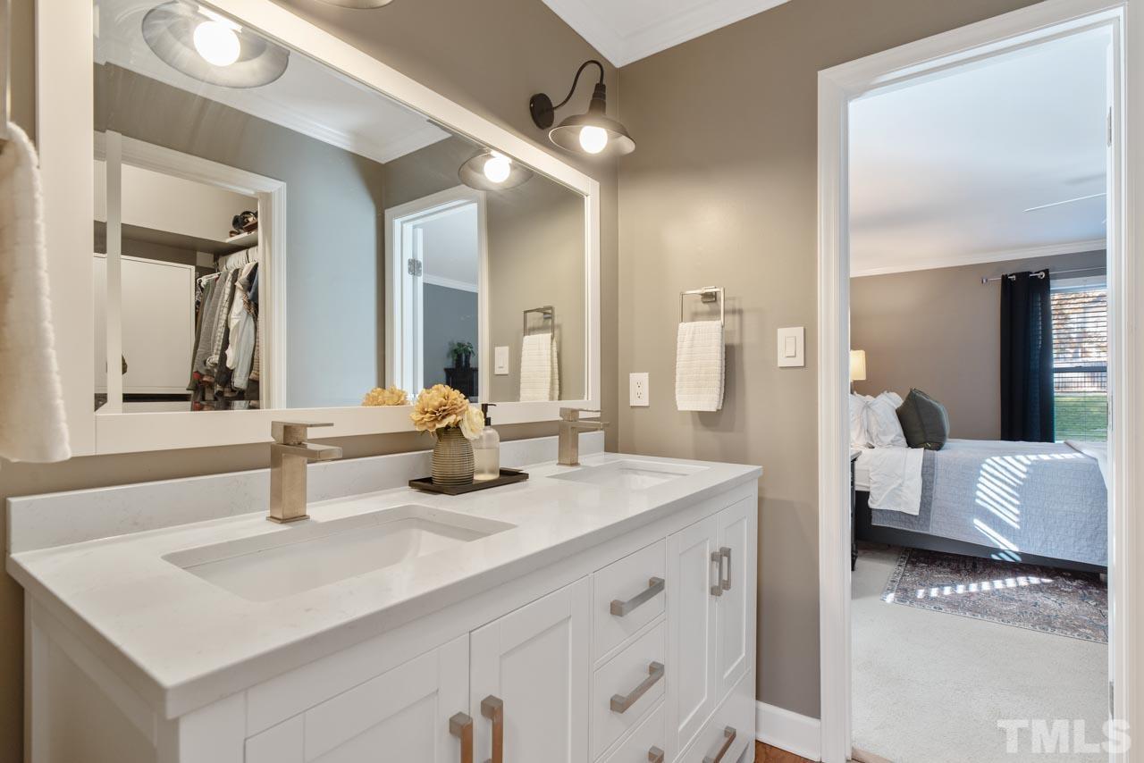 4309 Pleasant Grove Church Road Raleigh, NC 27613 - Photo 13 of 29 a bathroom with a sink and a mirror