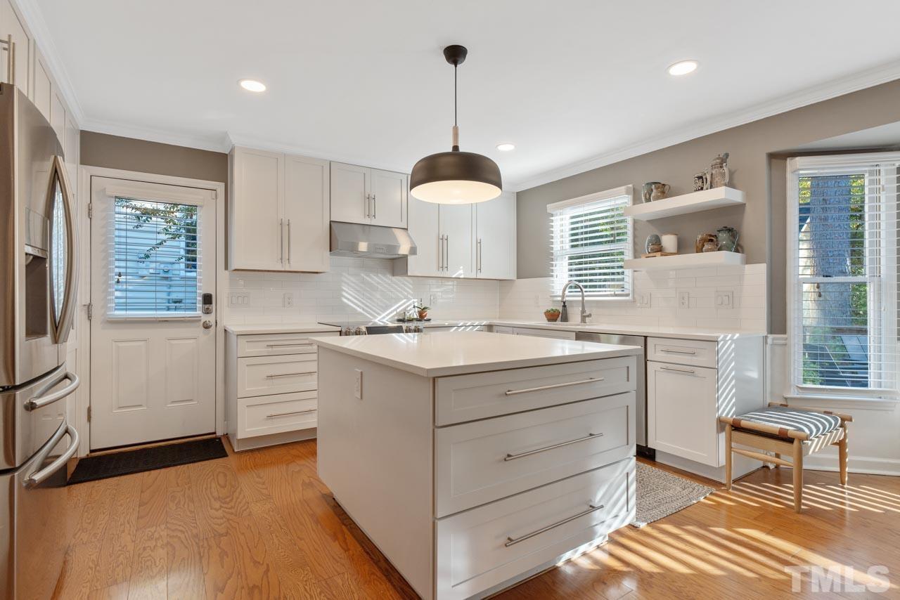 4309 Pleasant Grove Church Road Raleigh, NC 27613 - Photo 14 of 29 a kitchen with a sink cabinets and window