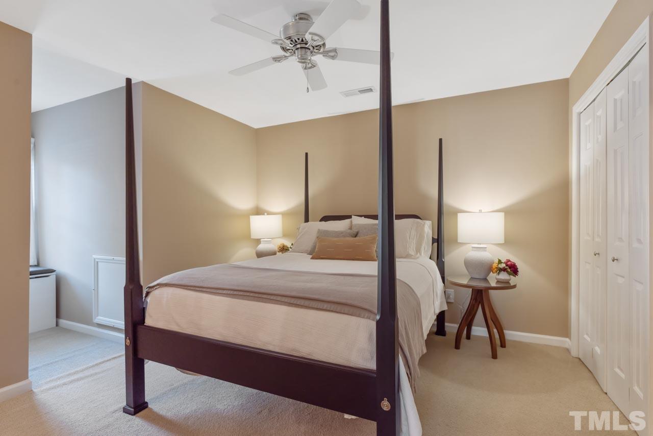 4309 Pleasant Grove Church Road Raleigh, NC 27613 - Photo 21 of 29 a bedroom with a bed and a lamp