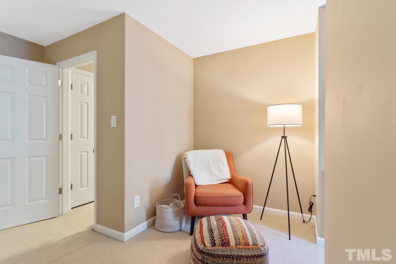 4309 Pleasant Grove Church Road Raleigh, NC 27613 - Photo 22 of 29 a living room with furniture and a wooden floor