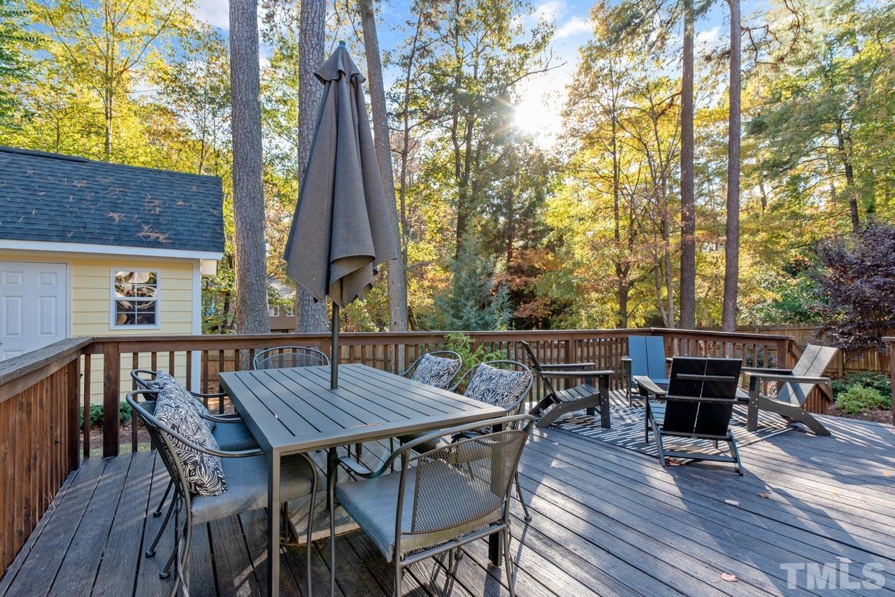 4309 Pleasant Grove Church Road Raleigh, NC 27613 - Photo 25 of 29 a view of a dinning table and chairs on the roof deck