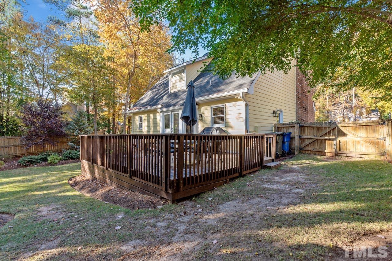 4309 Pleasant Grove Church Road Raleigh, NC 27613 - Photo 26 of 29 a view of a house with a yard and a large tree