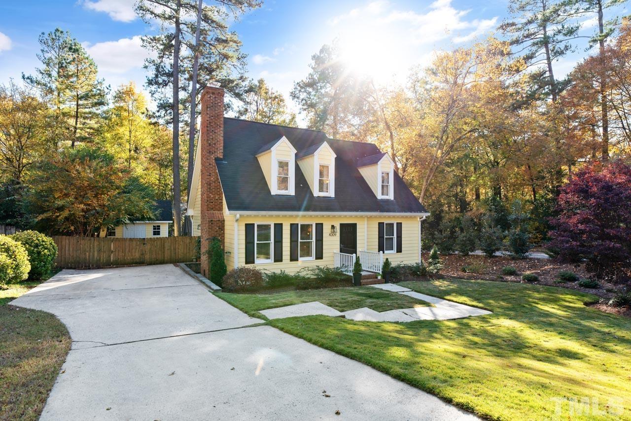 4309 Pleasant Grove Church Road Raleigh, NC 27613 - Photo 4 of 29 a front view of a house with garden