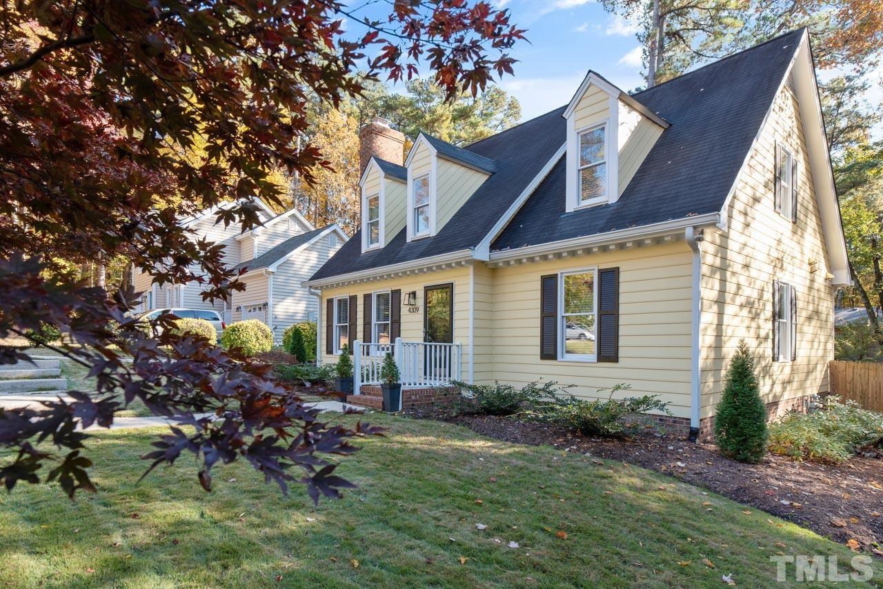 4309 Pleasant Grove Church Road Raleigh, NC 27613 - Photo 5 of 29 a front view of house with a garden
