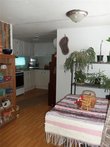 a bed room with a bed and a television