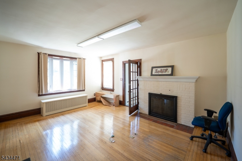 192 Lincoln Road Phillipsburg, NJ 08865 - Photo 17 of 50 a living room with furniture and a fireplace