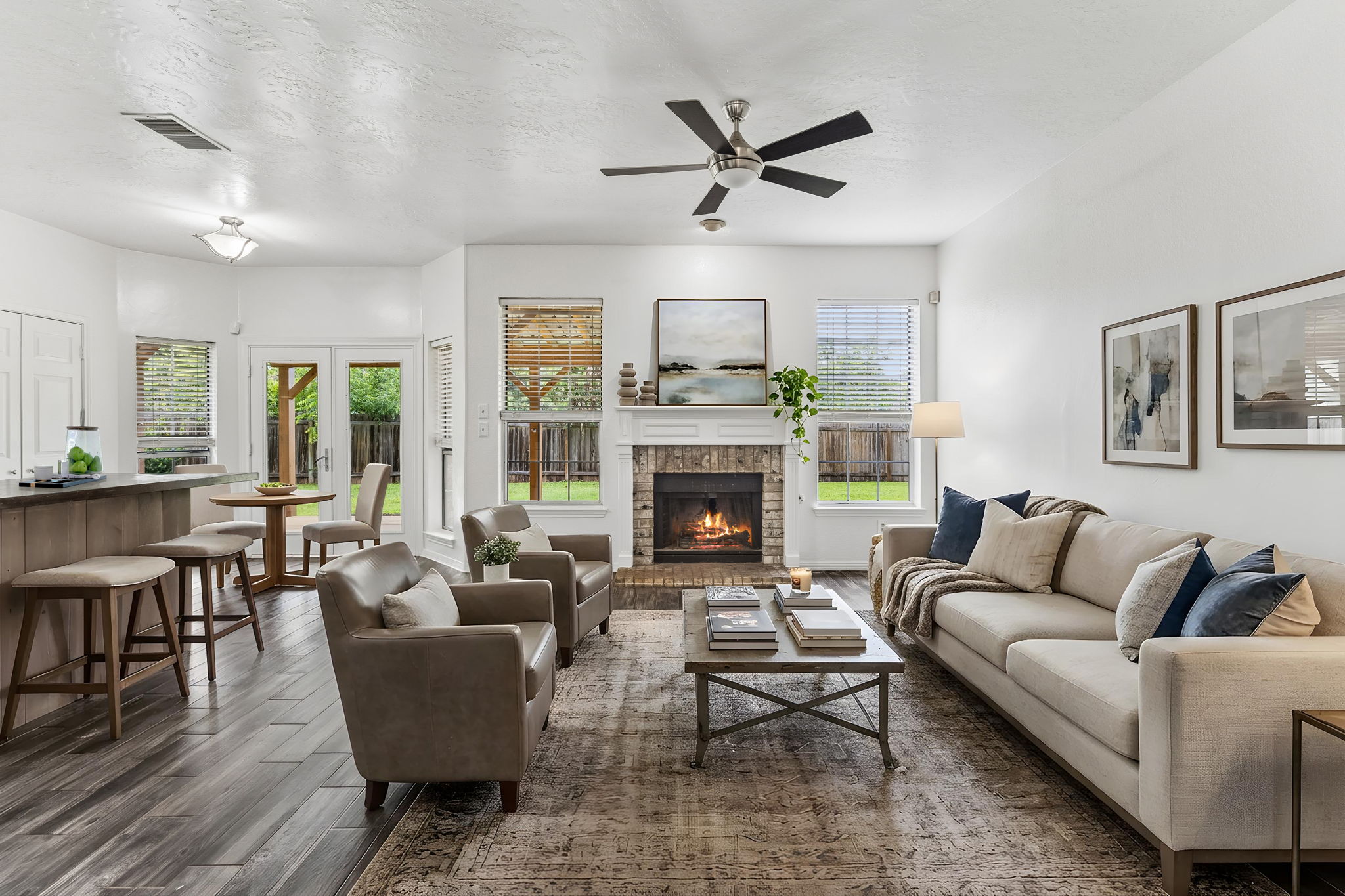 10400 O'Rourk Lane Austin, TX 78739 - Photo 3 of 33 a living room with furniture wooden floor and a fireplace