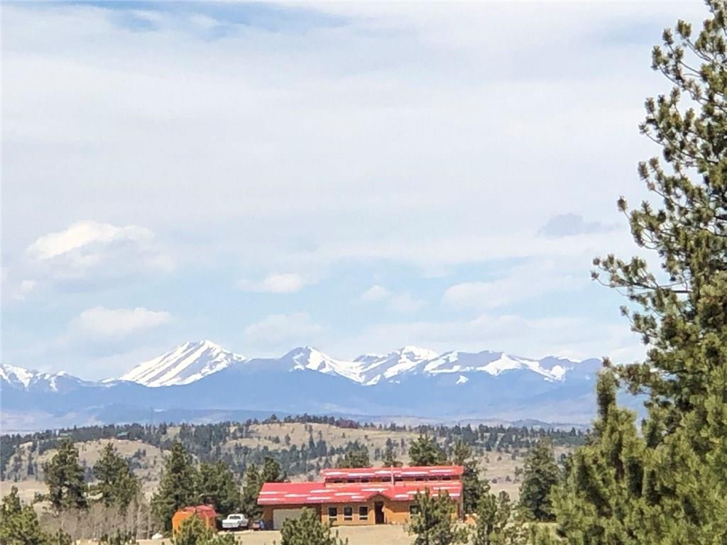 10380 Ranch Road Hartsel, CO 80449 - Photo 6 of 18 a view of a city with a building in the background