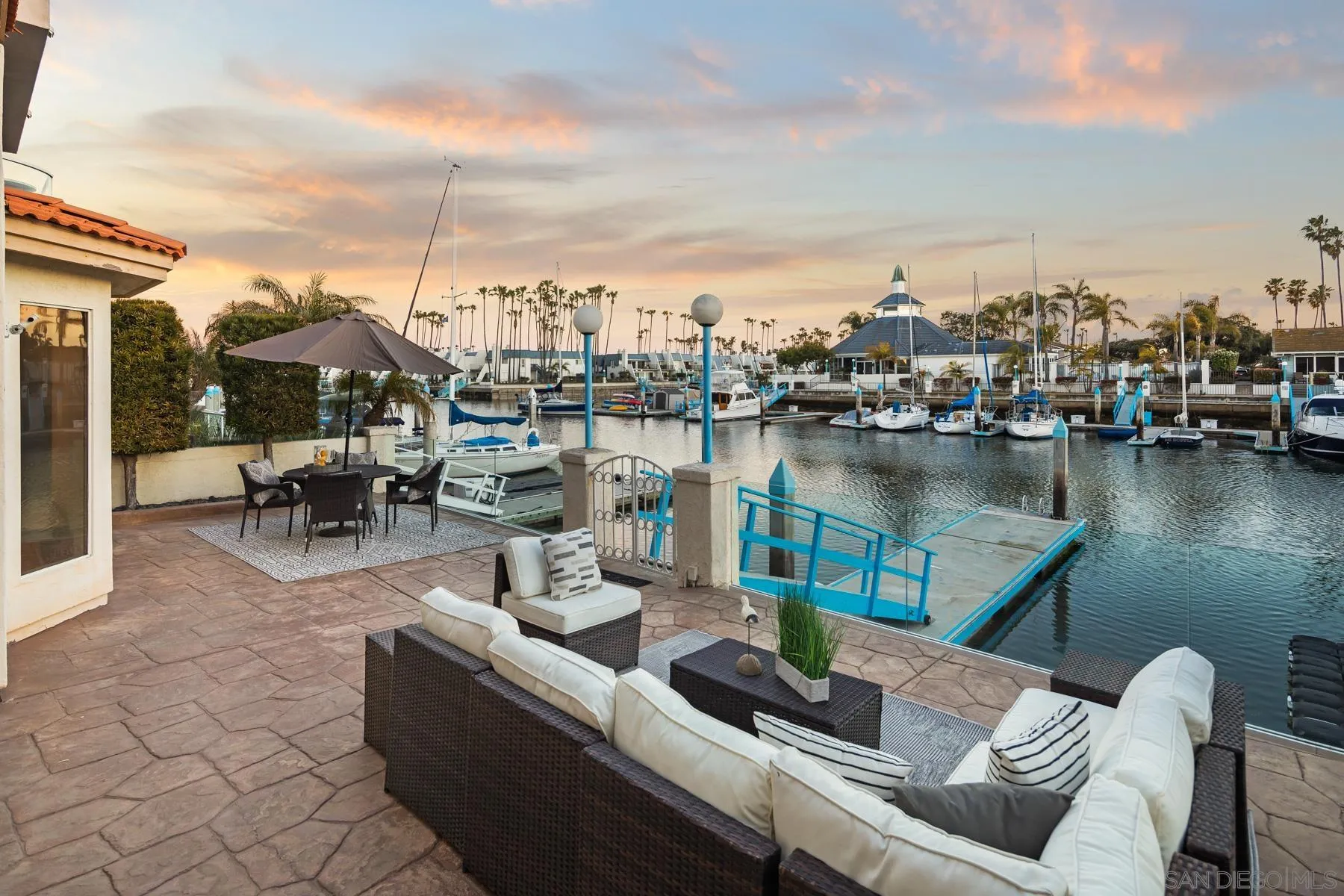 36 Green Turtle Road Coronado, CA 92118 - Photo 2 of 2 a view of a lake with couches chairs and city view
