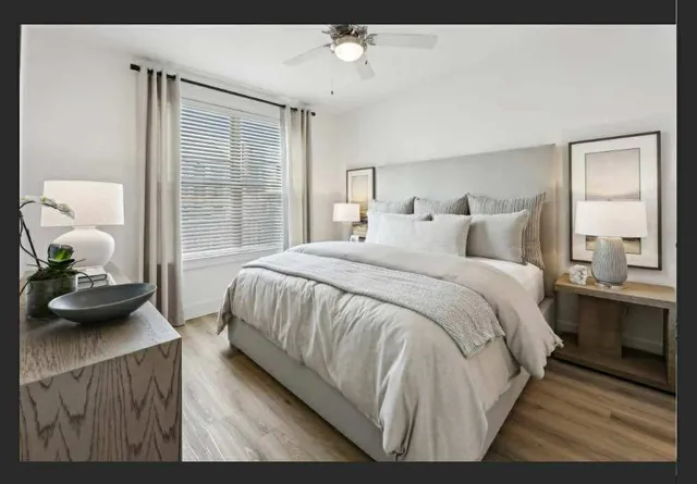 a bedroom with a bed and window