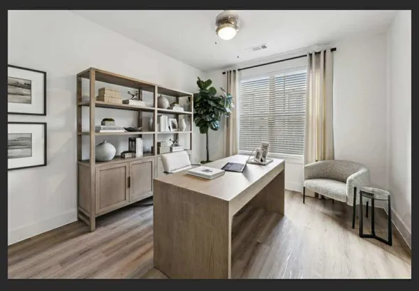 a kitchen with a sink and chairs
