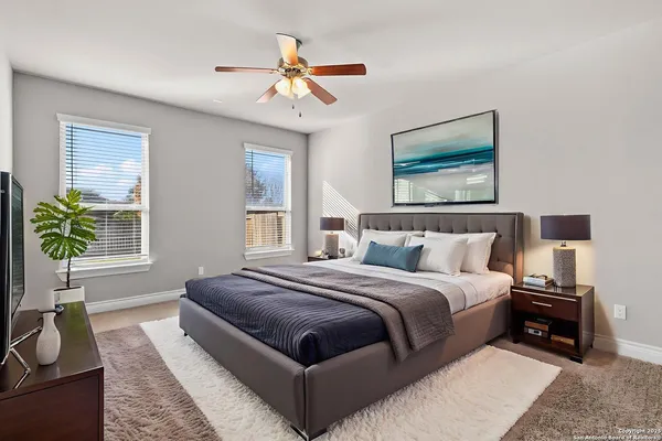 a bedroom with bed and a window