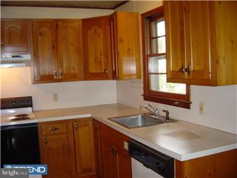 185 Tabernacle Road Medford Lakes, NJ 08055 - Photo 4 of 5 a kitchen with stainless steel appliances granite countertop a sink stove and cabinets