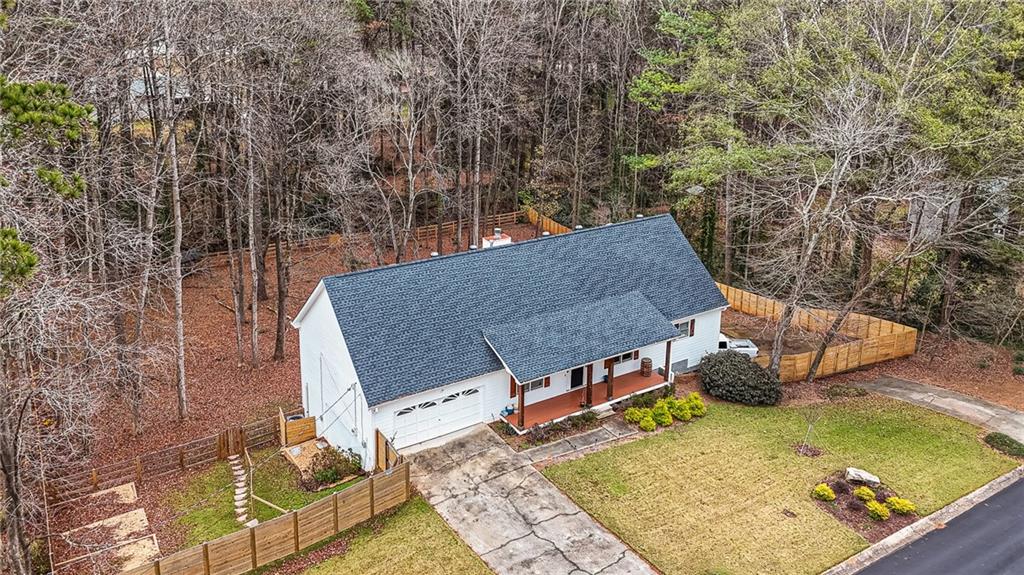 1394 Maple Drive Southwest Lilburn, GA 30047 - Photo 1 of 31 swimming pool view with a couple of outdoor seating