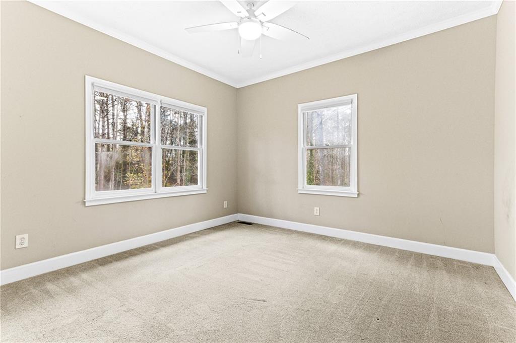 1394 Maple Drive Southwest Lilburn, GA 30047 - Photo 19 of 31 an empty room with a window