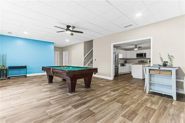 a room with furniture and kitchen view