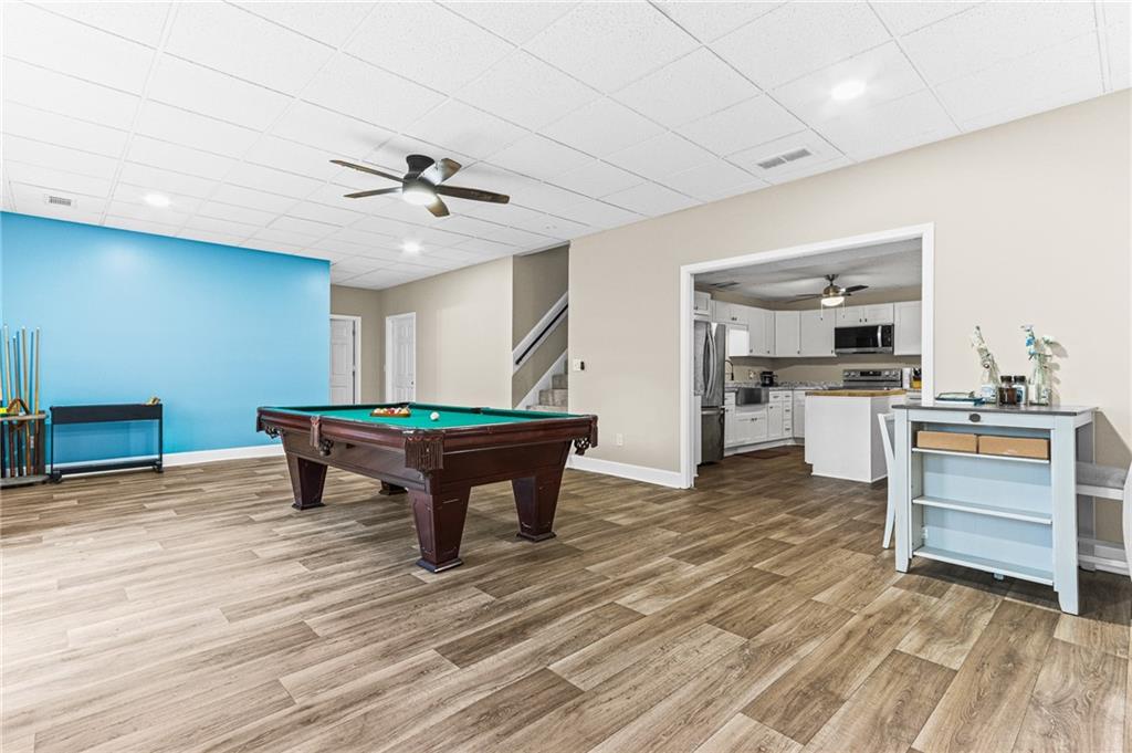 1394 Maple Drive Southwest Lilburn, GA 30047 - Photo 26 of 31 a room with furniture and kitchen view