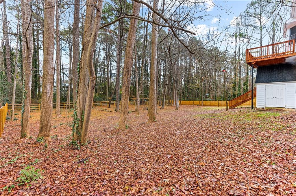 1394 Maple Drive Southwest Lilburn, GA 30047 - Photo 30 of 31 a view of a park with large trees