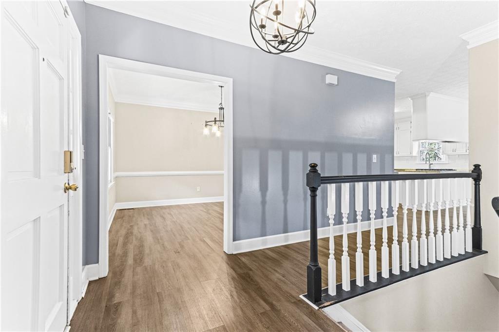 1394 Maple Drive Southwest Lilburn, GA 30047 - Photo 4 of 31 a view of a hallway with wooden floor