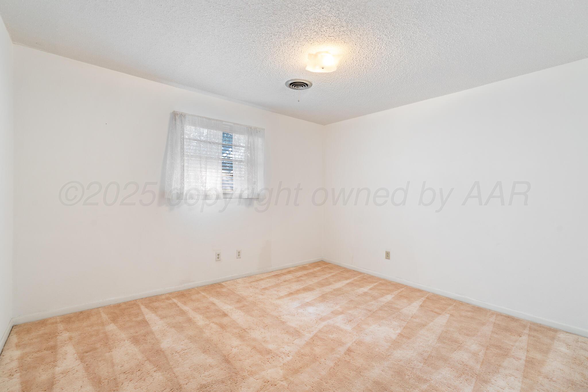 4803 Carole Lane Amarillo, TX 79110 - Photo 15 of 23 an empty room with a window