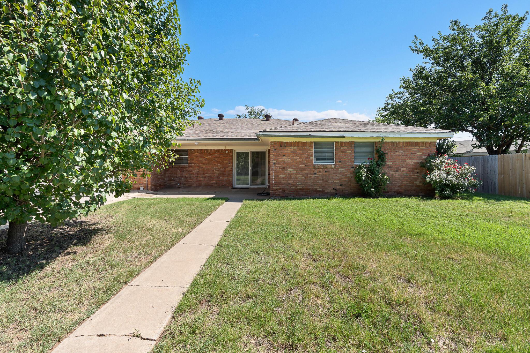 4803 Carole Lane Amarillo, TX 79110 - Photo 18 of 23 a front view of house with yard and green space